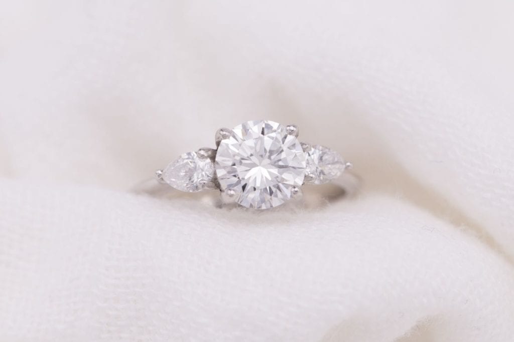 buying a one-carat diamond ring - three-stone ring with pear side stones