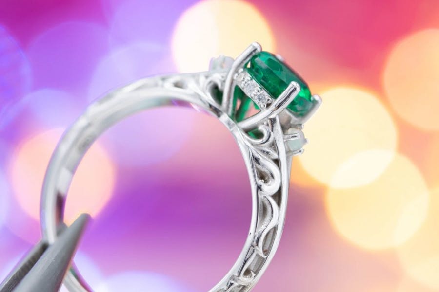 emerald with scrolling - engagement ring setting