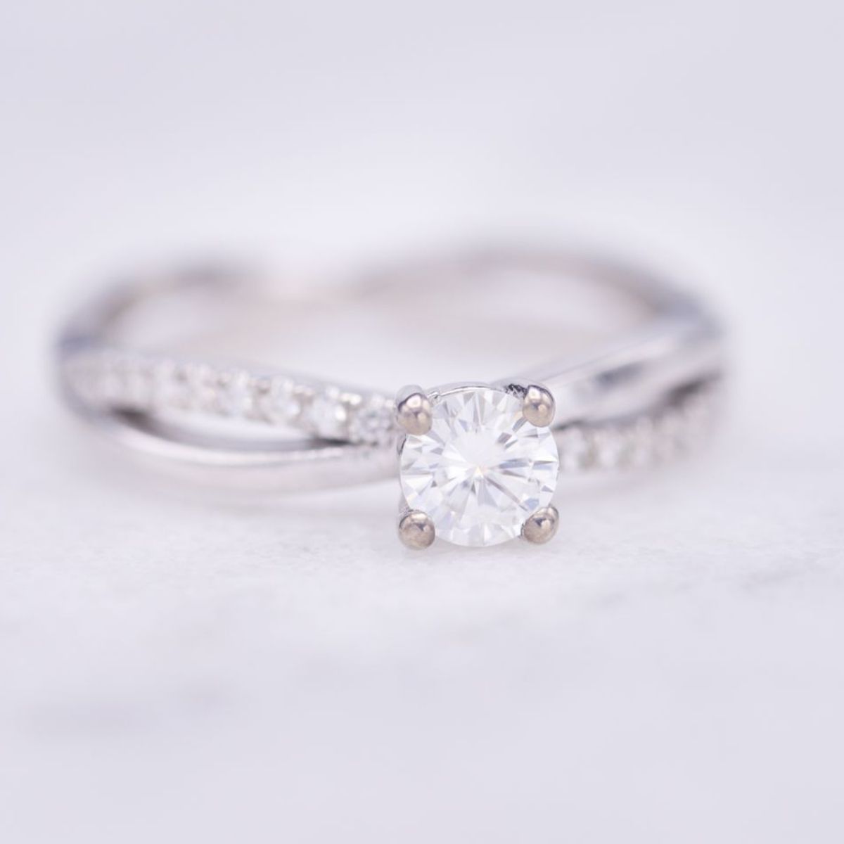 moissanite vs diamond - moissanite engagement ring twisting pave band