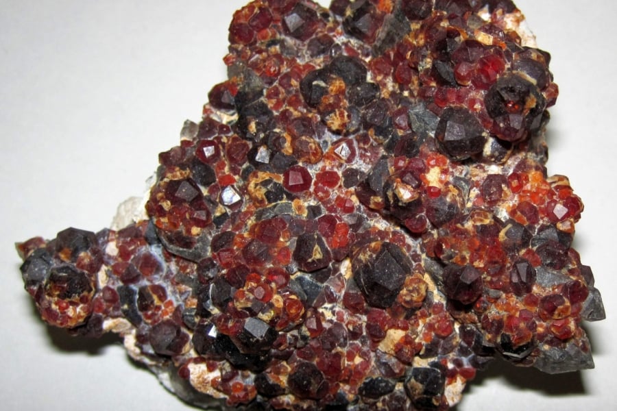 garnets in matrix, China - garnet symbolism and legends