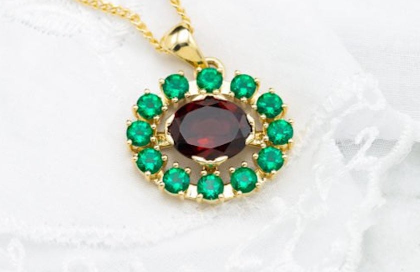 garnet and lab-created emerald pendant - garnet symbolism and legends