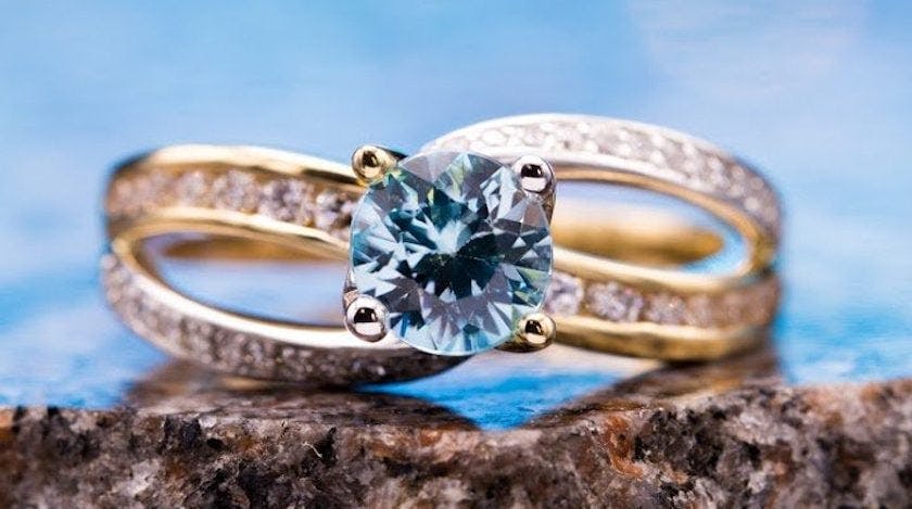 blue zircon with channel-set diamonds - engagement ring setting