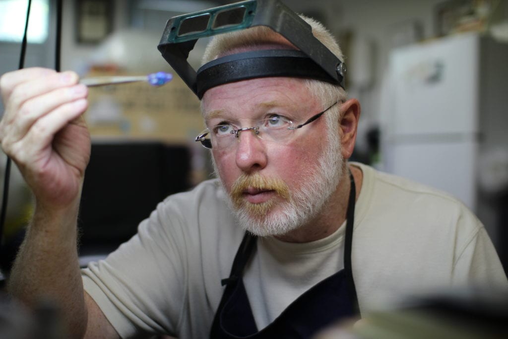 joel ragan examining opal - opal expert