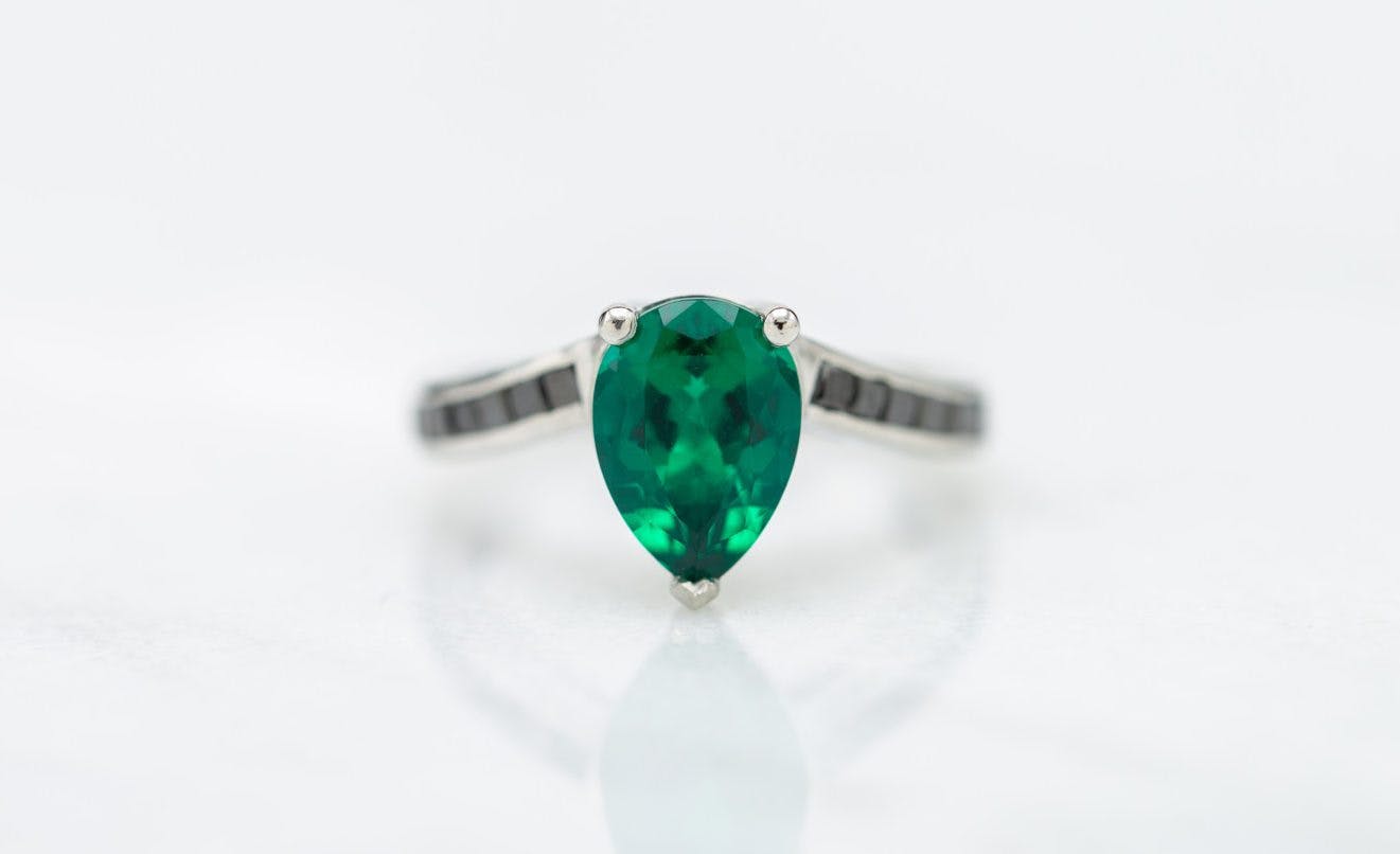 lab-made pear emerald ring