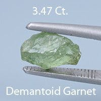 Rough version of Fancy Brilliant Emerald Cut Demantoid Garnet