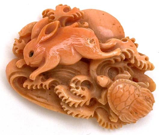 tortoise and hare coral carving - gemstone investment budget and basis