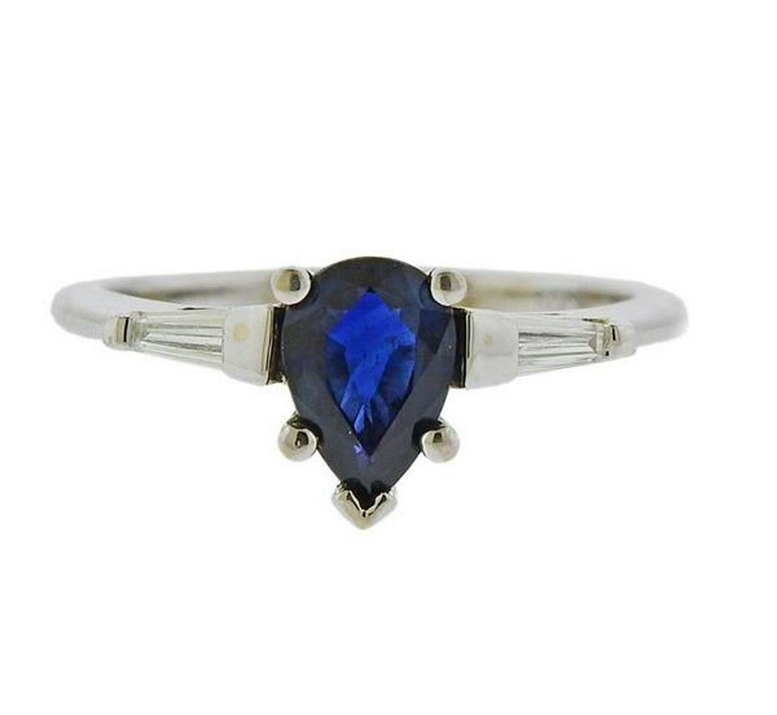 white gold engagement ring with sapphire center stone