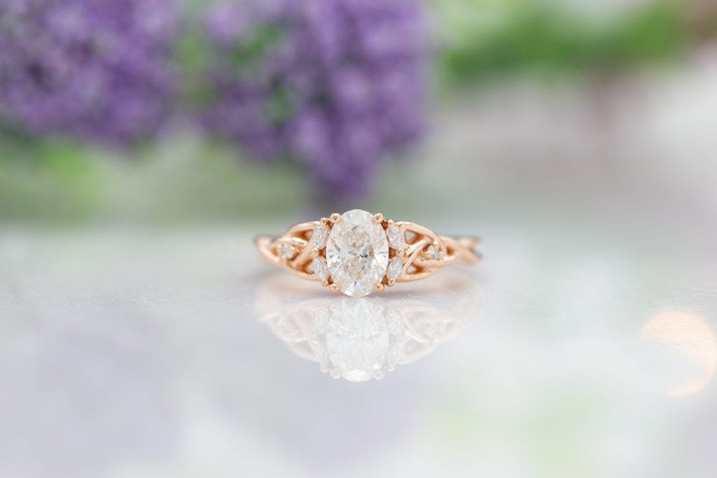 lab-created, oval-cut diamond in rose gold ring