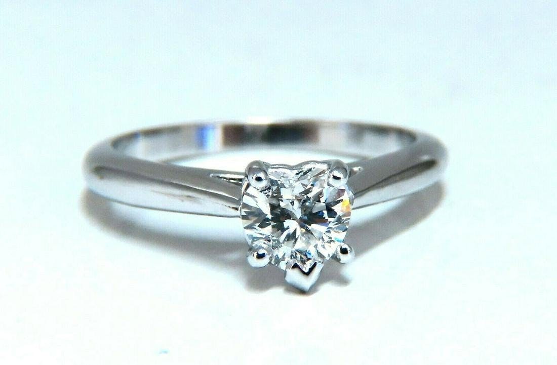 platinum engagement ring with heart-cut diamond