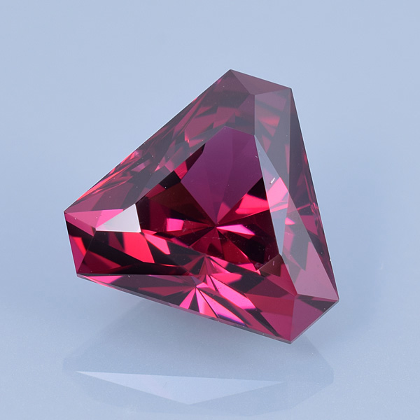 Finished version of Custom Triangle Cut Rhodolite Garnet