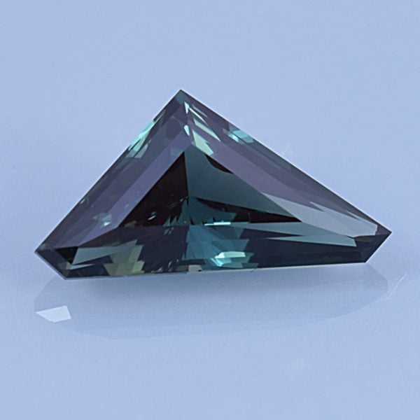 Finished version of Custom Triangular Freeform Cut Sapphire