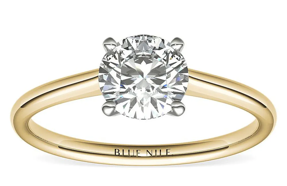 yellow gold ring with petite solitaire - most popular diamond shapes 