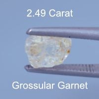 Rough version of Custom Elongated Triangle Cut Leuco Grossular Garnet
