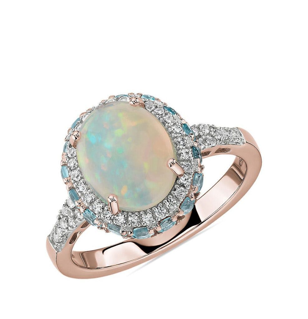 Oval Opal and Swiss Blue Topaz Halo Ring in 14k Rose Gold Blue Nile