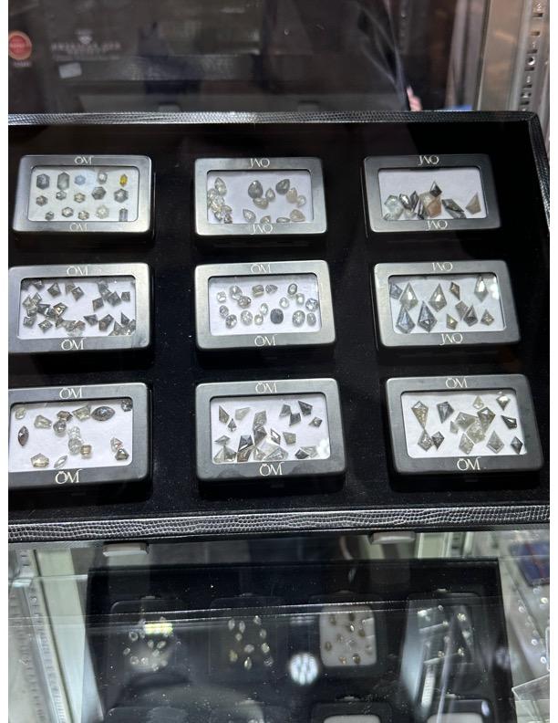  salt-and-pepper diamonds sold by OM Imports Inc.