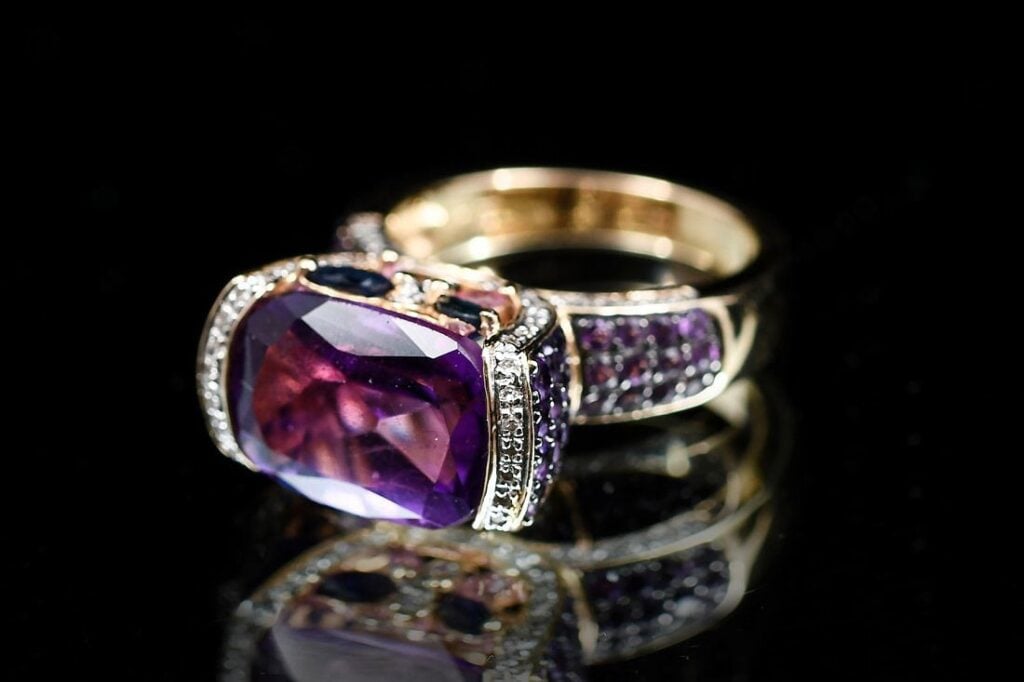 yellow gold ring with natural and synthetic amethyst gemstones