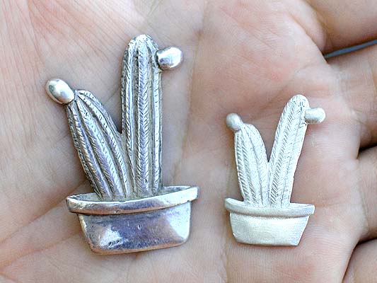 identical precious metal clay pins in different sizes