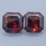 Finished version of Square Barion Cut Malaya Garnet Pair