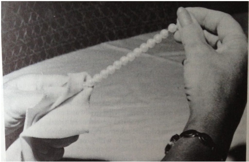 Never immerse a pearl necklace in soapy water. Always use a damp rag.