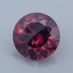 Finished version of Fancy 10-Sided Round Brilliant Cut Rhodolite Garnet