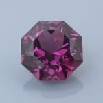 Finished version of Fancy Brilliant Octagon Cut Rhodolite Garnet