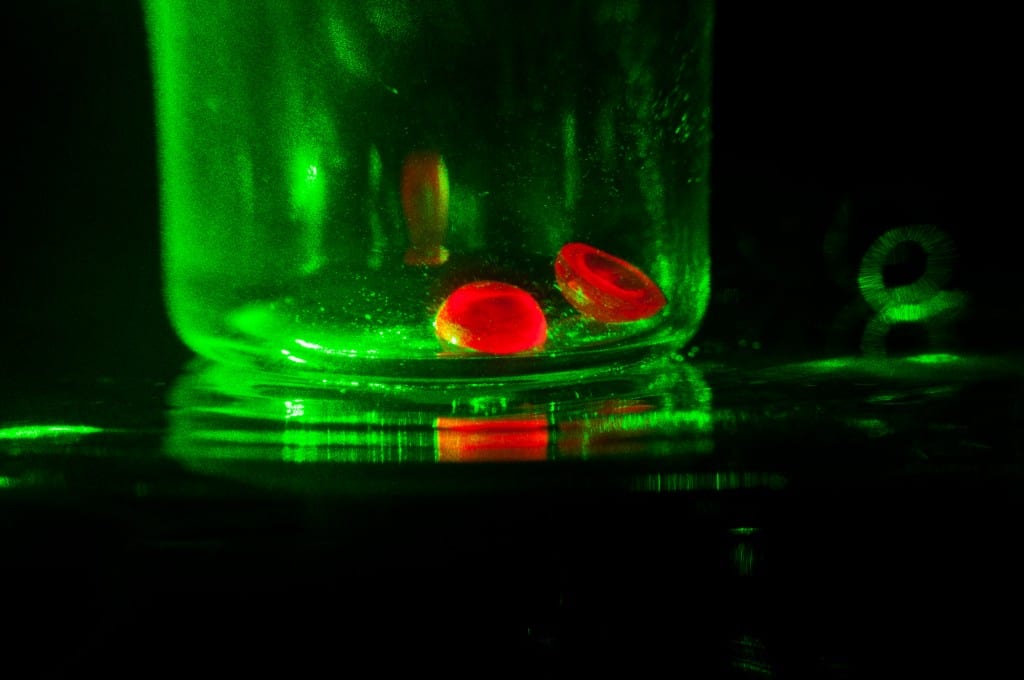 Synthetic or lab-grown corundum (ruby and sapphire) has the same physical and chemical properties as natural corundum. Polishing synthetic corundum can leave pits on the gemstones. Gem cutters can avoid this problem with the right tools and techniques. “Artificial Ruby Hemisphere Under a Monochromatic light” by D.328 is licensed under CC By-SA 3.0