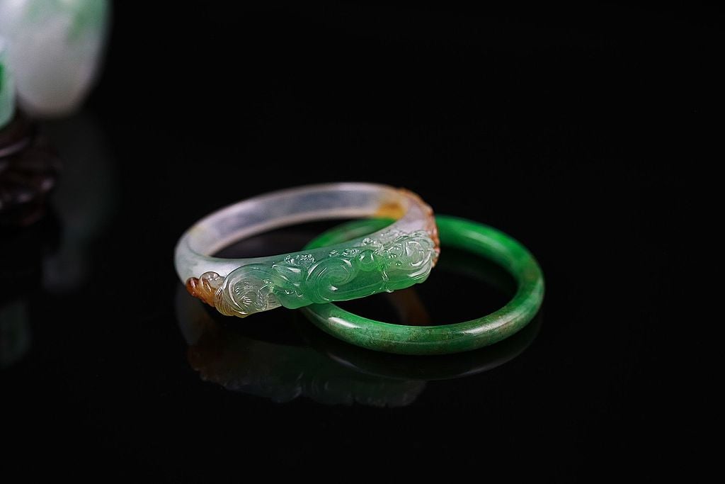 Green jade bangle. Imperial green jade and gold bangle. | CanStock