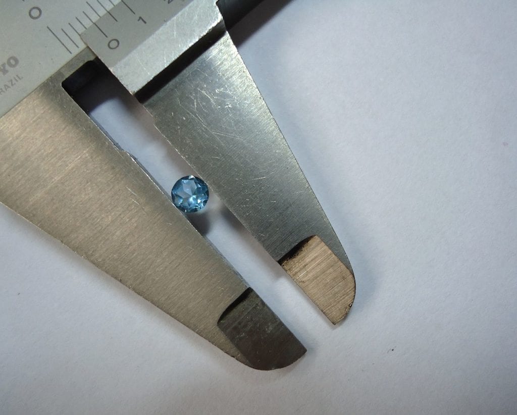 how to spot a fake diamond - measuring with calipers