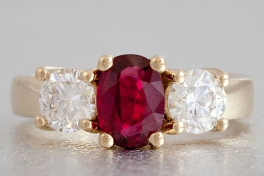 Ruby and Diamond Three-Stone Halo Engagement Ring