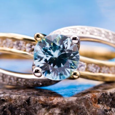 blue zircon with channel-set diamonds - engagement ring setting