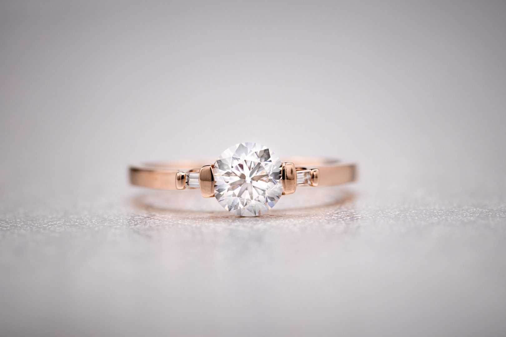 round diamond with baguette side stones - vintage engagement rings