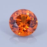 Finished version of Fancy Twisted Round Brilliant Cut Spessartite Garnet