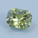 Finished version of Barion Emerald Cut Demantoid Garnet