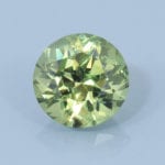 Finished version of Fancy Round Brilliant Cut Demantoid Garnet