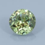 Finished version of FAncy Round Brilliant Cut Demantoid Garnet
