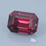 Finished version of Emerald Cut Rhodolite Garnet