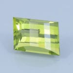 Finished version of Opposed Bar Rhombus Cut Peridot
