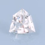 Finished version of Custom Barion Shield Cut Leuco Grossular Garnet