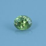 Finished version of Custom Brilliant Oval Cut Demantoid Garnet